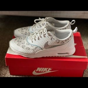 White/silver cheetah Nike tennis shoes